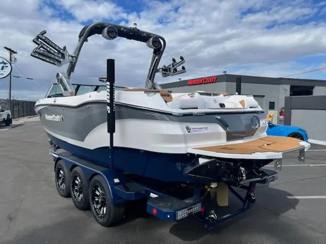 Slide: The Image of 2024 MasterCraft X24 boat with luxurious seating and modern design. - 8