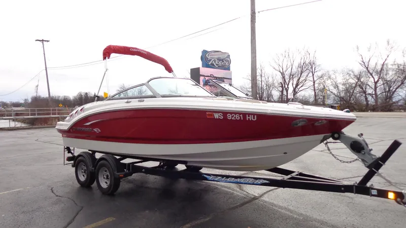 The Image of 2011 Chaparral 206 SSi boat on trailer with red and white exterior. - 0