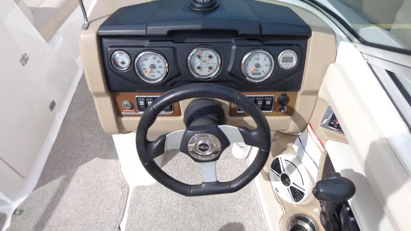 Slide: The Image of 2011 Chaparral 206 SSi boat dashboard with steering wheel and instrument panel. - 10