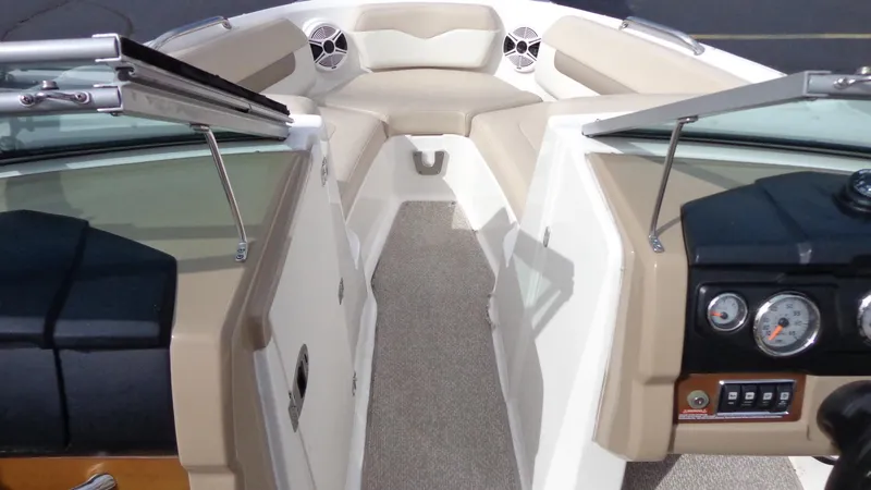 Slide: The Image of 2011 Chaparral 206 SSi boat interior with beige seating and dashboard. - 12