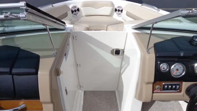 Slide: The Image of 2011 Chaparral 206 SSi boat interior with open windshield and dashboard. - 13