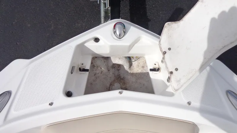 Slide: The Image of Open storage compartment on a 2011 Chaparral 206 SSi boat. - 18