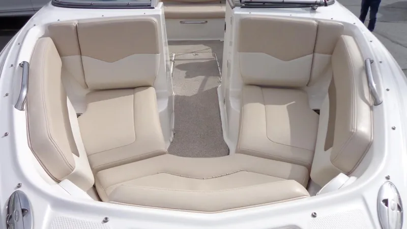 Slide: The Image of 2011 Chaparral 206 SSi boat interior with beige seating. - 19
