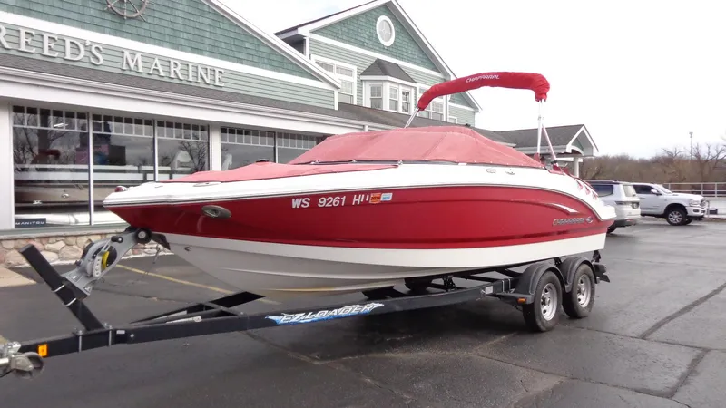 Slide: The Image of 2011 Chaparral 206 SSi boat with red cover on trailer at Reed's Marine. - 27