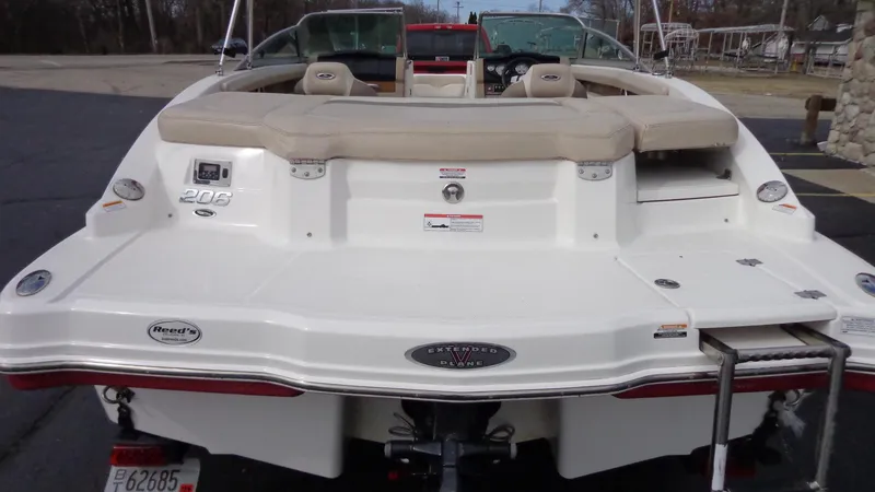 Slide: The Image of 2011 Chaparral 206 SSi boat rear view with swim platform and ladder. - 3