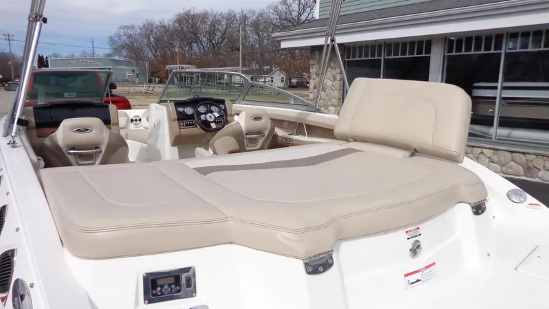 Slide: The Image of 2011 Chaparral 206 SSi boat with beige seating and modern dashboard. - 5