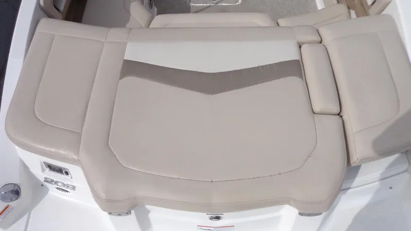 Slide: The Image of 2011 Chaparral 206 SSi boat rear seating area with beige upholstery. - 6