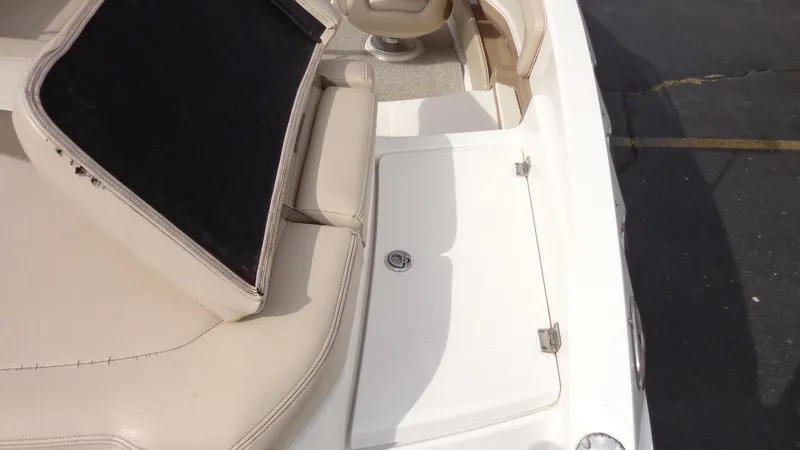 Slide: The Image of 2011 Chaparral 206 SSi boat interior with open storage compartment. - 8