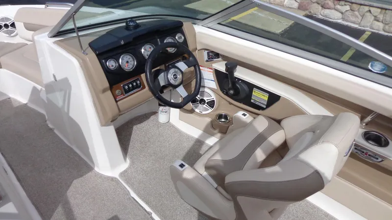 Slide: The Image of 2011 Chaparral 206 SSi boat interior with steering wheel and dashboard. - 9