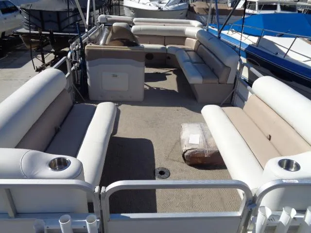 The Image of 2004 Sylvan Sunchaser 824 pontoon boat with spacious seating and clean deck. - 0