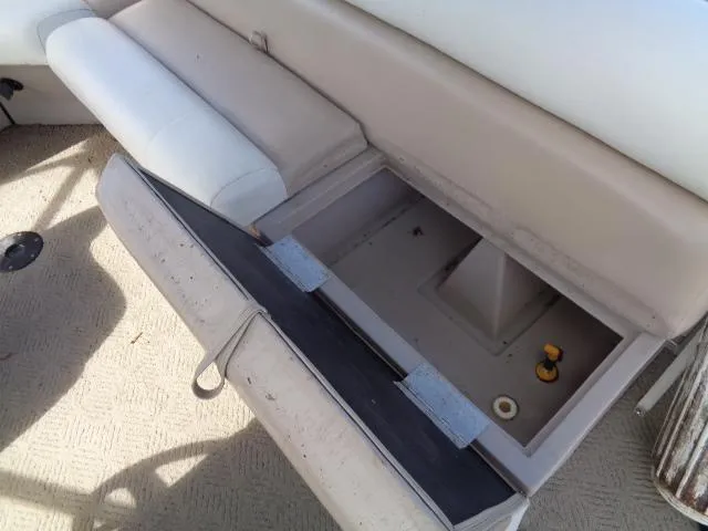Slide: The Image of Open storage compartment on a 2004 Sylvan SUNCHASER 824 boat. - 13