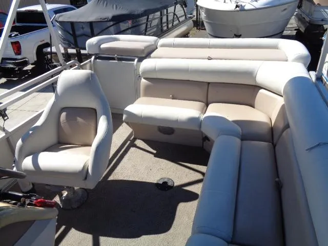 Slide: The Image of 2004 Sylvan SUNCHASER 824 boat interior with beige seating. - 23