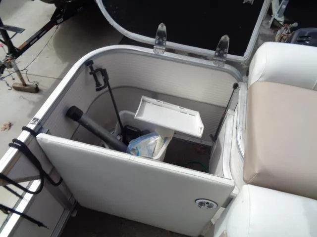 Slide: The Image of Open storage compartment on a 2004 Sylvan SUNCHASER 824 boat. - 25