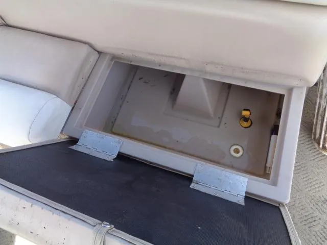 Slide: The Image of Open storage compartment in a 2004 Sylvan SUNCHASER 824 boat. - 26