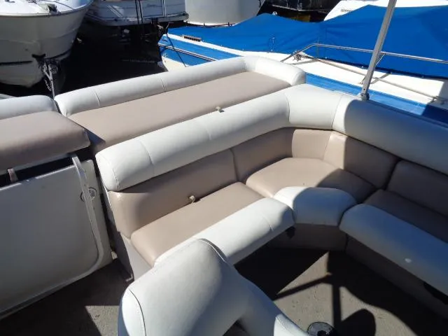 Slide: The Image of 2004 Sylvan SUNCHASER 824 pontoon boat with beige and white seating. - 3