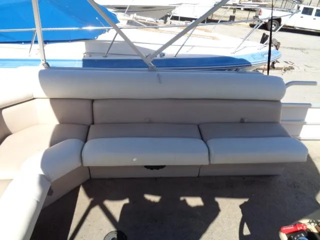 Slide: The Image of 2004 Sylvan SUNCHASER 824 boat interior with white cushioned seating. - 4
