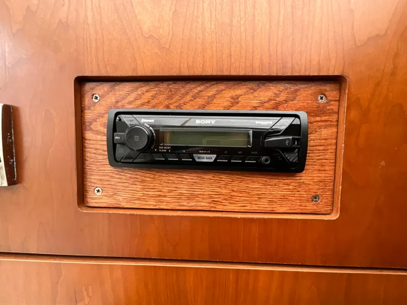 Slide: The Image of Sony stereo system in 2002 Cruisers Express boat's wooden interior. - 23