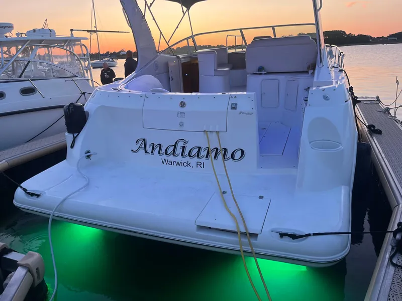 Slide: The Image of 2002 Cruisers Express boat Andiamo docked at sunset in Warwick, RI. - 24