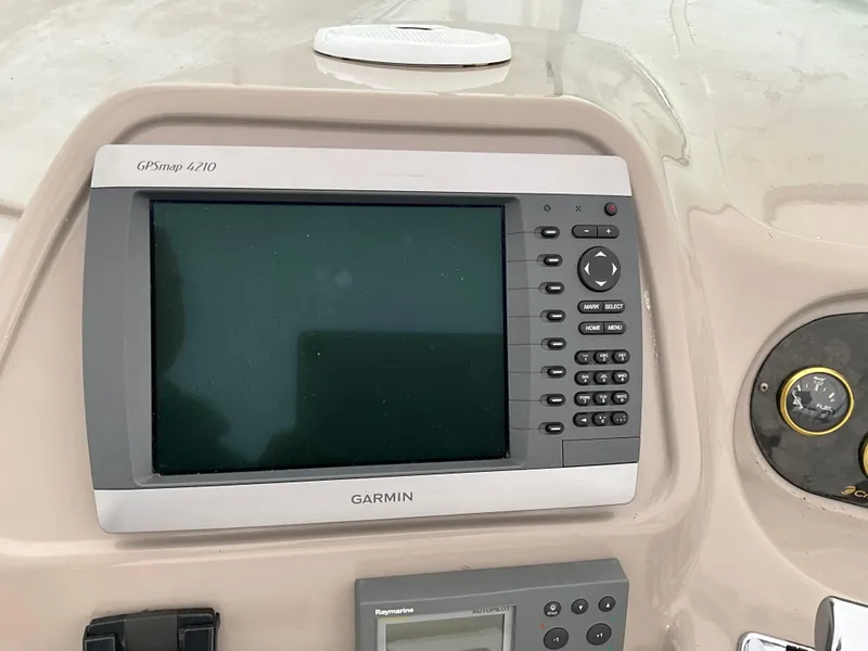 Slide: The Image of Garmin GPSmap 4210 on 2002 Cruisers Express boat dashboard. - 4