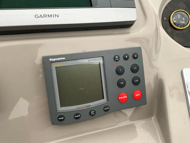 Slide: The Image of Raymarine autopilot control panel on a 2002 Cruisers Express boat. - 5