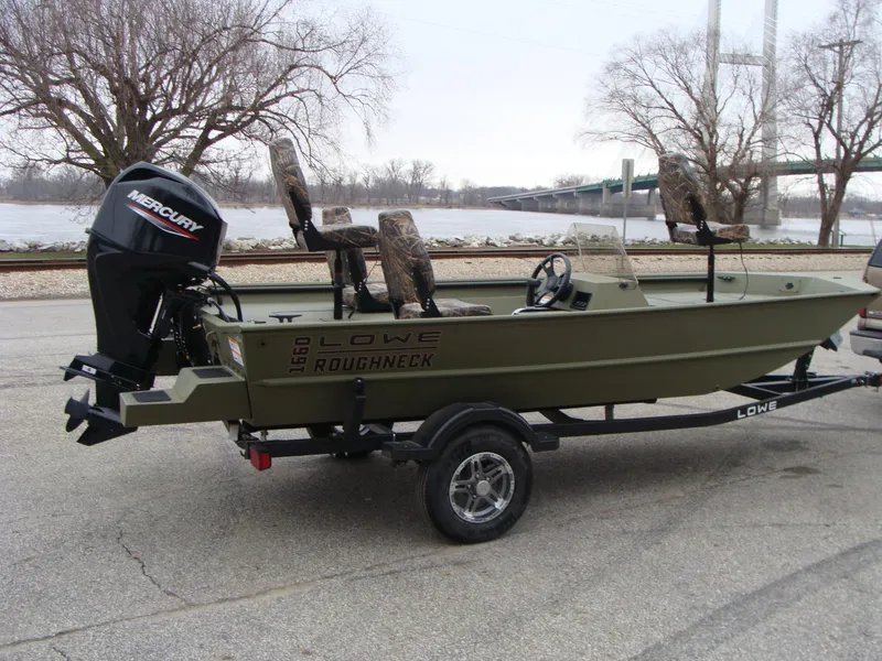 Slide: The Image of 2023 Lowe RX 1660 SC Roughneck boat on trailer with Mercury outboard motor. - 2