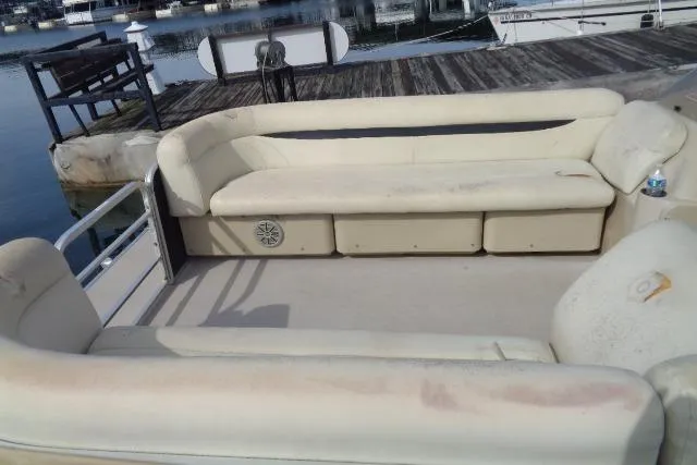 Slide: The Image of 2017 Godfrey Sweetwater pontoon boat with beige seating at a dock. - 37
