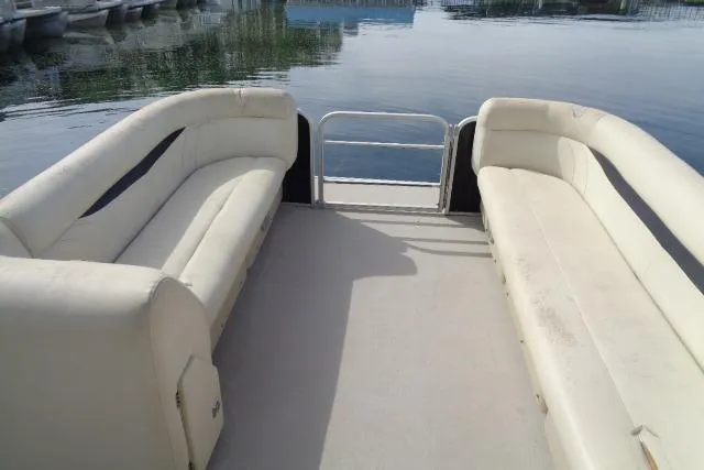 Slide: The Image of 2017 Godfrey Sweetwater pontoon boat interior with beige seating and open deck. - 38