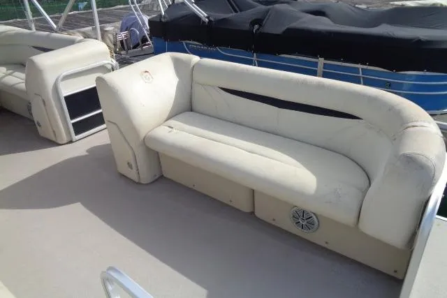 Slide: The Image of 2017 Godfrey Sweetwater boat interior with white seating and speaker. - 40