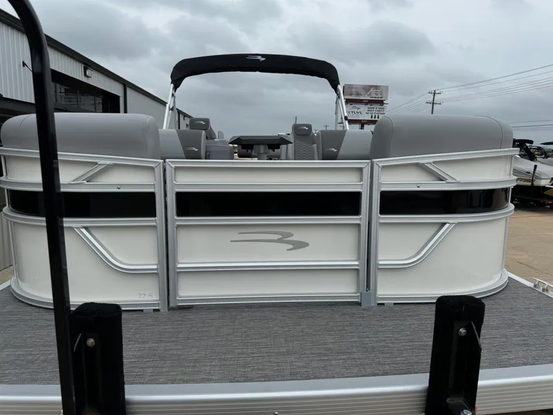 Slide: The Image of 2024 Bennington 22 S Swingback pontoon boat with sleek design and gray seating. - 10