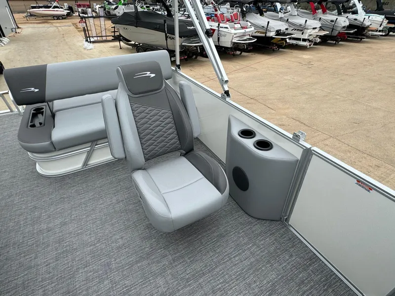 Slide: The Image of 2024 Bennington 22 S Swingback boat interior with gray seating and cup holders. - 17
