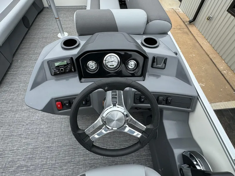 Slide: The Image of 2024 Bennington 22 S Swingback boat dashboard with steering wheel and controls. - 20