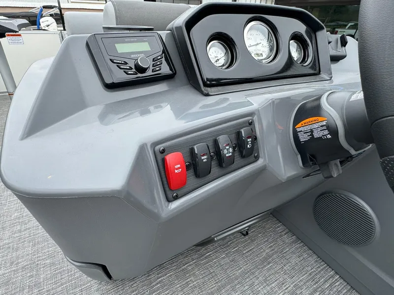 Slide: The Image of 2024 Bennington 22 S Swingback dashboard with controls and gauges. - 22