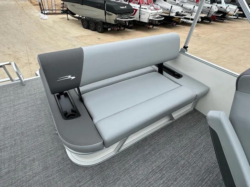 Slide: The Image of 2024 Bennington 22 S Swingback boat seat with cup holders, gray upholstery, and sleek design. - 26