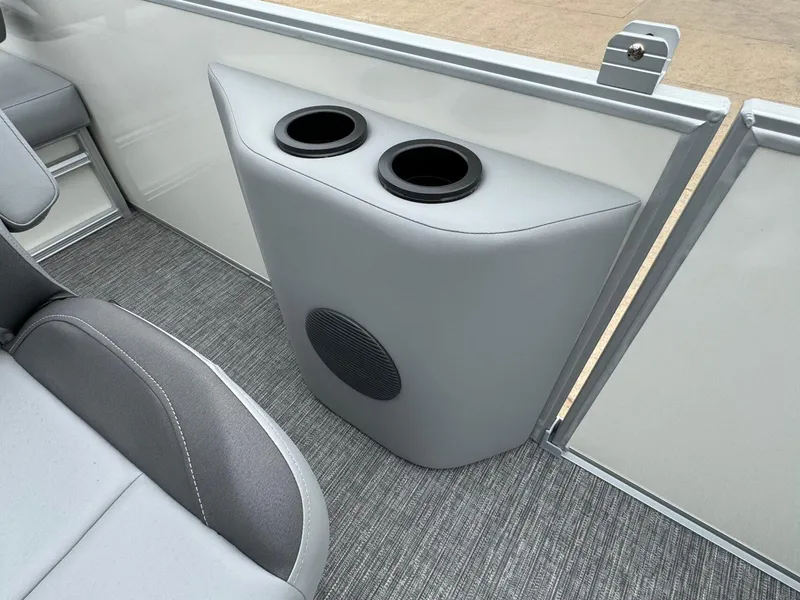 Slide: The Image of 2024 Bennington 22 S Swingback interior with cup holders and speaker. - 31