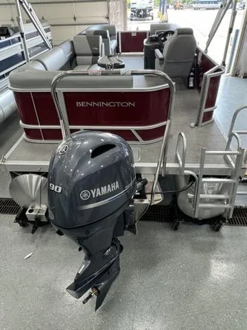 Slide: The Image of 2024 Bennington 20 SVL pontoon boat with Yamaha 90 outboard motor in showroom. - 12