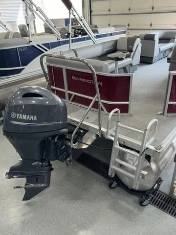 Slide: The Image of 2024 Bennington 20 SVL pontoon boat with Yamaha outboard motor in showroom. - 13