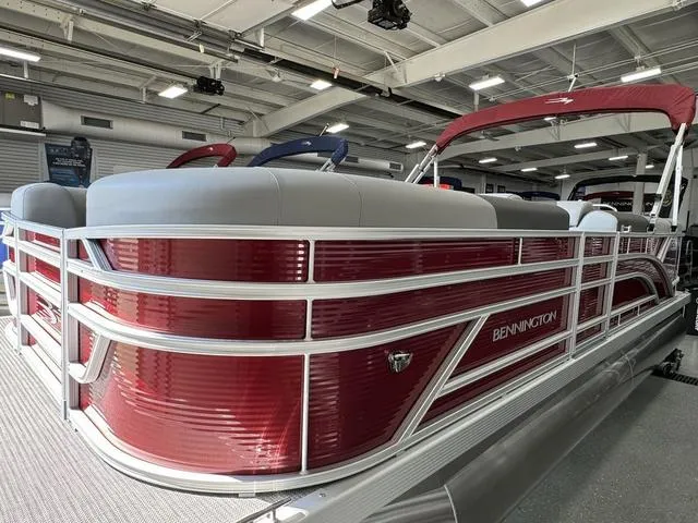 Slide: The Image of 2024 Bennington 20 SVL pontoon boat with red exterior in showroom. - 14