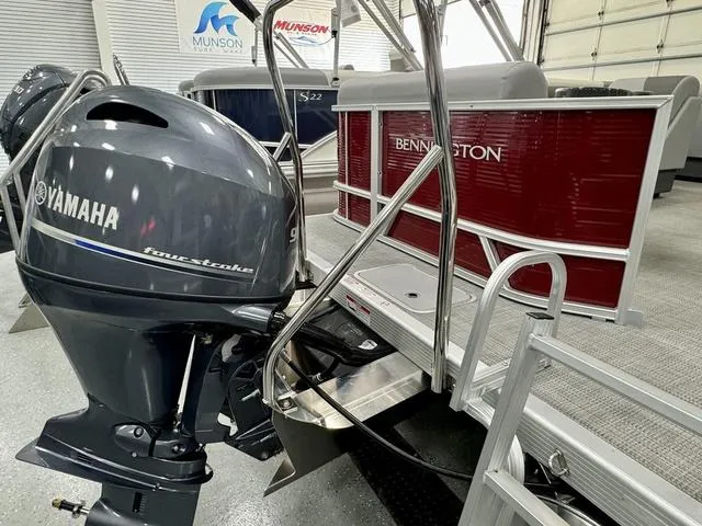 Slide: The Image of 2024 Bennington 20 SVL pontoon boat with Yamaha outboard motor in showroom. - 16