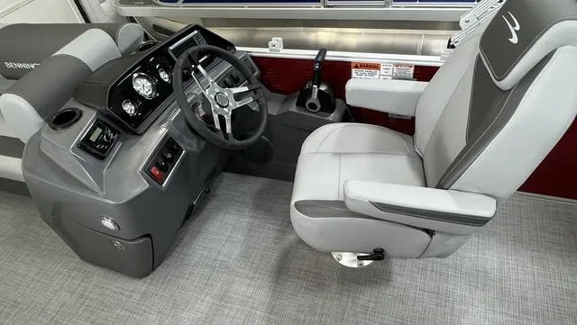 Slide: The Image of 2024 Bennington 20 SVL boat interior with steering console and captain's chair. - 23