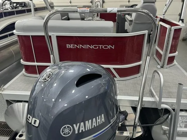 Slide: The Image of 2024 Bennington 20 SVL pontoon boat with Yamaha 90 engine, red and silver design. - 26