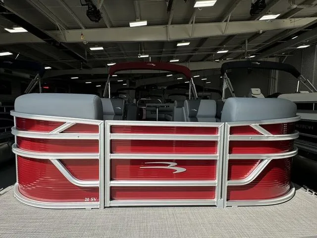 Slide: The Image of 2024 Bennington 20 SVL pontoon boat with red exterior in showroom. - 4