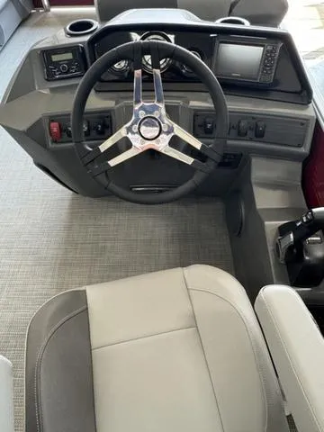 Slide: The Image of 2024 Bennington 20 SVL boat dashboard with steering wheel and controls. - 5