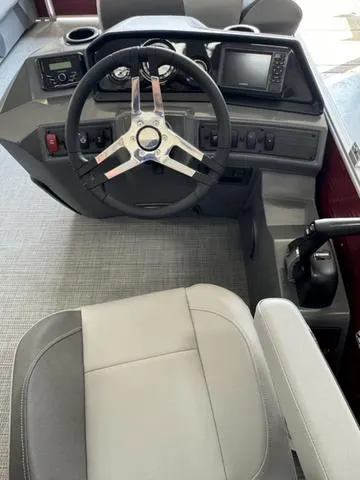 Slide: The Image of 2024 Bennington 20 SVL boat cockpit with steering wheel and control panel. - 6