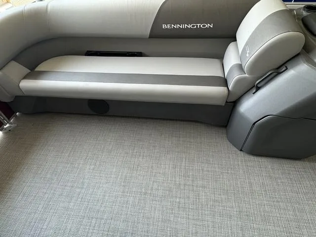 Slide: The Image of 2024 Bennington 20 SVL boat interior with gray seating and flooring. - 8