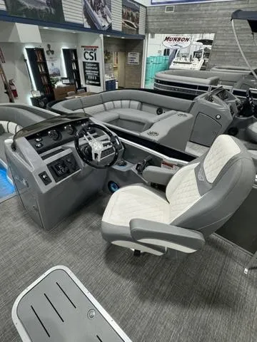 Slide: The Image of 2024 Bennington 25 LTSB boat interior with modern helm and seating. - 10
