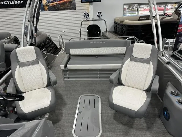 Slide: The Image of 2024 Bennington 25 LTSB boat interior with plush seating and modern design. - 14