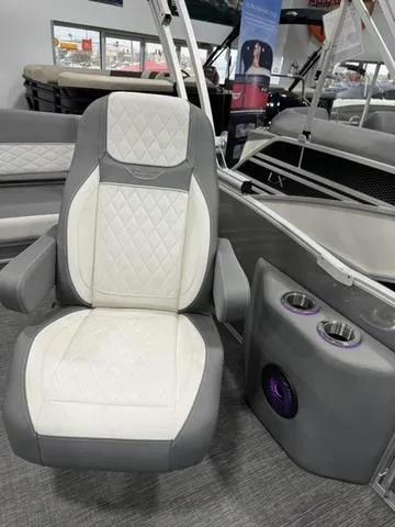 Slide: The Image of 2024 Bennington 25 LTSB boat interior with luxury seating and cup holders. - 16
