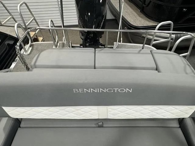 Slide: The Image of 2024 Bennington 25 LTSB boat with gray seating and elegant design. - 25