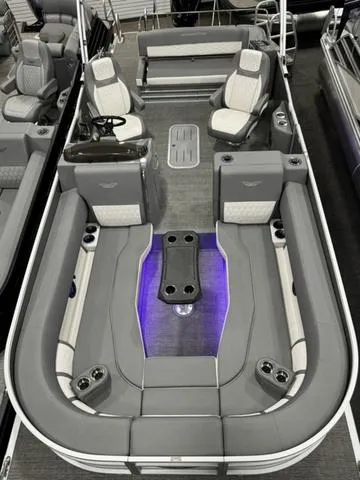 Slide: The Image of 2024 Bennington 25 LTSB pontoon boat with luxurious seating and ambient lighting. - 32