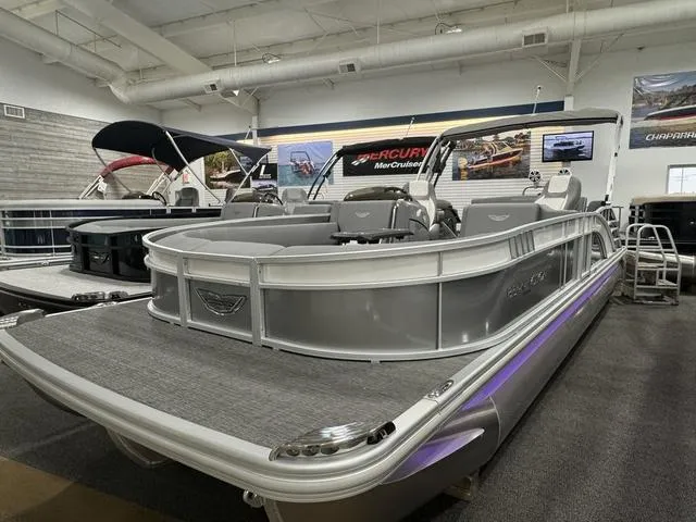 Slide: The Image of 2024 Bennington 25 LTSB pontoon boat displayed in showroom. - 4